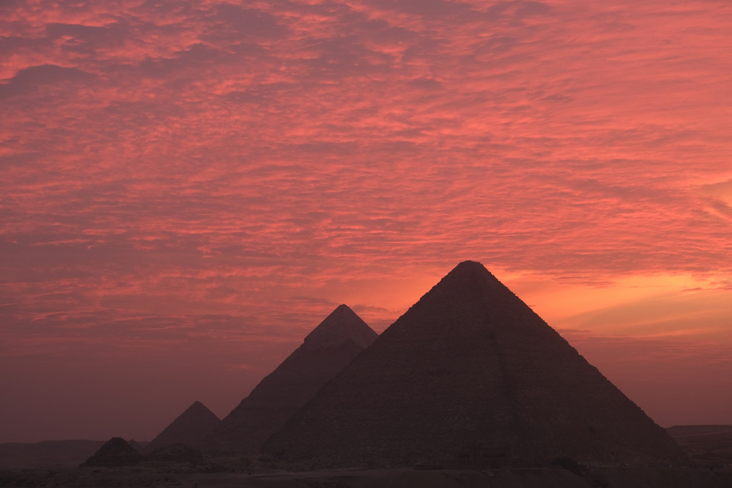 The monumental pyramids of Giza rising from the Egyptian desert